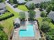 An aerial view of a community pool showcasing lounge chairs and a sun-soaked deck at 918 Kite Dr, Fort Mill, SC 29715