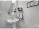 Charming powder room with pedestal sink and decorative accents at 918 Kite Dr, Fort Mill, SC 29715