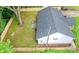 An aerial view showcases the fenced yard, patio, roof, and landscaping at 9208 Detroiter Dr, Huntersville, NC 28078