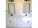 Beautiful bathroom featuring dual sinks, sleek black fixtures and elegant countertops at 9208 Detroiter Dr, Huntersville, NC 28078