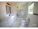 Charming bathroom complete with a modern vanity and a shower-over-tub at 9208 Detroiter Dr, Huntersville, NC 28078