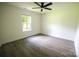 Well-lit bedroom featuring a window to let natural light and sleek flooring at 9208 Detroiter Dr, Huntersville, NC 28078