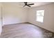 Spacious bedroom featuring a ceiling fan and ample natural light at 9208 Detroiter Dr, Huntersville, NC 28078