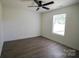 Bedroom showcasing a ceiling fan and bright window illuminating a cozy space at 9208 Detroiter Dr, Huntersville, NC 28078