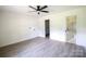 Clean bedroom with neutral tones, featuring bathroom access at 9208 Detroiter Dr, Huntersville, NC 28078