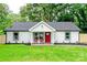 Charming home with a bright red door and a well-manicured front lawn at 9208 Detroiter Dr, Huntersville, NC 28078