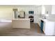 Modern kitchen with stainless steel appliances, white cabinets, and a large island at 9208 Detroiter Dr, Huntersville, NC 28078