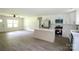 Spacious layout with modern appliances and island, connecting kitchen to living area at 9208 Detroiter Dr, Huntersville, NC 28078