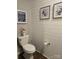 Updated bathroom with shiplap walls, modern fixtures, and a water closet at 1224 Dali Blvd, Mount Holly, NC 28120