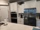 Modern kitchen with stainless steel appliances, double oven, and ample counter space at 1224 Dali Blvd, Mount Holly, NC 28120