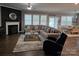 Spacious living room features a large sofa, fireplace, and ample natural light at 1224 Dali Blvd, Mount Holly, NC 28120