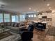 Open-concept living area with modern kitchen, dining area, and comfortable seating space at 1224 Dali Blvd, Mount Holly, NC 28120