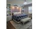 Main bedroom features built-in shelves, a decorative headboard, and natural light at 1224 Dali Blvd, Mount Holly, NC 28120
