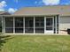 A view of the screened-in porch from the backyard, offering an additional area for relaxation at 1224 Dali Blvd, Mount Holly, NC 28120
