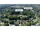 Aerial view shows the property near Woodside Community Park with pool and tennis court at 12325 Woodside Falls Rd, Pineville, NC 28134