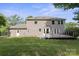 Home exterior boasts a spacious backyard, deck, and manicured lawn at 12325 Woodside Falls Rd, Pineville, NC 28134