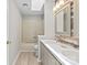 Bright bathroom showcasing double sink vanity, decorative mirror, and a shower-tub combo at 12325 Woodside Falls Rd, Pineville, NC 28134