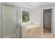 Bathroom with tub, shower, and closet access at 12325 Woodside Falls Rd, Pineville, NC 28134