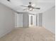 Spacious bedroom featuring a ceiling fan and bright white trim at 12325 Woodside Falls Rd, Pineville, NC 28134