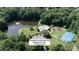 Woodside Community Park's aerial view featuring a pool, playground, and tennis court at 12325 Woodside Falls Rd, Pineville, NC 28134