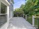 Spacious deck features railings and overlooks the lush backyard and landscaping at 12325 Woodside Falls Rd, Pineville, NC 28134
