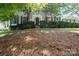 Two-story home with symmetrical windows, well-maintained landscaping, and classic architectural details at 12325 Woodside Falls Rd, Pineville, NC 28134