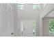 Grand foyer showcasing a soaring ceiling and bright natural light at 12325 Woodside Falls Rd, Pineville, NC 28134