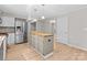 Eat-in kitchen featuring stainless appliances and center island at 12325 Woodside Falls Rd, Pineville, NC 28134
