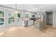 The kitchen offers stainless appliances, a center island, and recessed lighting at 12325 Woodside Falls Rd, Pineville, NC 28134