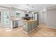 Eat-in kitchen featuring stainless appliances, recessed lighting, and white cabinets at 12325 Woodside Falls Rd, Pineville, NC 28134