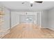 Open floor plan with wood floors and plenty of natural light at 12325 Woodside Falls Rd, Pineville, NC 28134