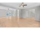 Spacious living room featuring wood floors and an open floor plan at 12325 Woodside Falls Rd, Pineville, NC 28134