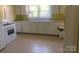 Spacious kitchen with ample white cabinetry and a window over the sink at 1242 Mitchell Ave, Statesville, NC 28677