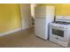 Basic kitchen features a white refrigerator and stove at 1242 Mitchell Ave, Statesville, NC 28677