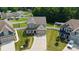 Aerial view of a two-story home with a manicured lawn and driveway at 12704 Franklin Square Rd, Charlotte, NC 28213