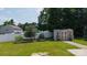 Fenced backyard with a storage shed and lush lawn, perfect for outdoor activities and relaxation at 12704 Franklin Square Rd, Charlotte, NC 28213
