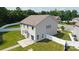 Aerial view of the backyard with a white fence, lush green grass, and patio at 12704 Franklin Square Rd, Charlotte, NC 28213