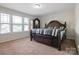 Bedroom with carpet and a large wood bed frame and an armoire at 12704 Franklin Square Rd, Charlotte, NC 28213