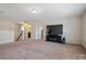 Second floor living room with carpet flooring and a dark entertainment center at 12704 Franklin Square Rd, Charlotte, NC 28213