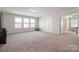 Spacious bonus room with carpet floors, bright windows and access to a full bathroom at 12704 Franklin Square Rd, Charlotte, NC 28213