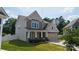 Charming two-story home featuring a welcoming front porch, attached two-car garage, and well-maintained lawn at 12704 Franklin Square Rd, Charlotte, NC 28213