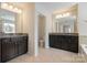 Spacious main bathroom with double vanity, tile floors, and a separate toilet room at 12704 Franklin Square Rd, Charlotte, NC 28213