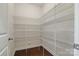 Walk-in pantry with metal shelving and hardwood floors; great for ample storage at 12704 Franklin Square Rd, Charlotte, NC 28213