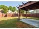 Backyard view featuring a covered patio with ceiling fan, perfect for relaxation and entertaining at 13115 Meadowmere Rd, Huntersville, NC 28078