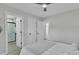 Relaxing bedroom featuring an ensuite bathroom with a stand-up shower and light wood flooring at 13115 Meadowmere Rd, Huntersville, NC 28078