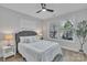 Comfortable bedroom featuring soft, natural light, light wood flooring, and a neutral color palette at 13115 Meadowmere Rd, Huntersville, NC 28078