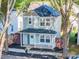Charming two-story home with a welcoming front porch and a beautifully landscaped front yard at 13115 Meadowmere Rd, Huntersville, NC 28078