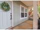 Inviting front porch with a decorative wreath and a view of the neighborhood at 13115 Meadowmere Rd, Huntersville, NC 28078