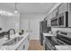 Bright kitchen with stainless steel appliances and adjacent breakfast nook at 13115 Meadowmere Rd, Huntersville, NC 28078