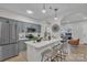Modern kitchen featuring stainless steel appliances, sleek countertops, and an island at 13115 Meadowmere Rd, Huntersville, NC 28078